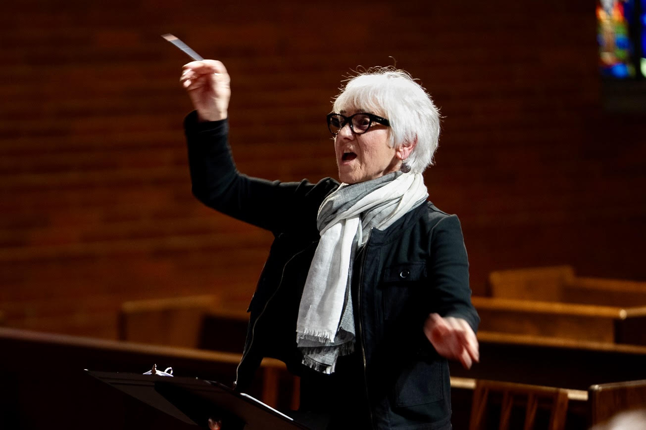Composer Joan Szymko conducting